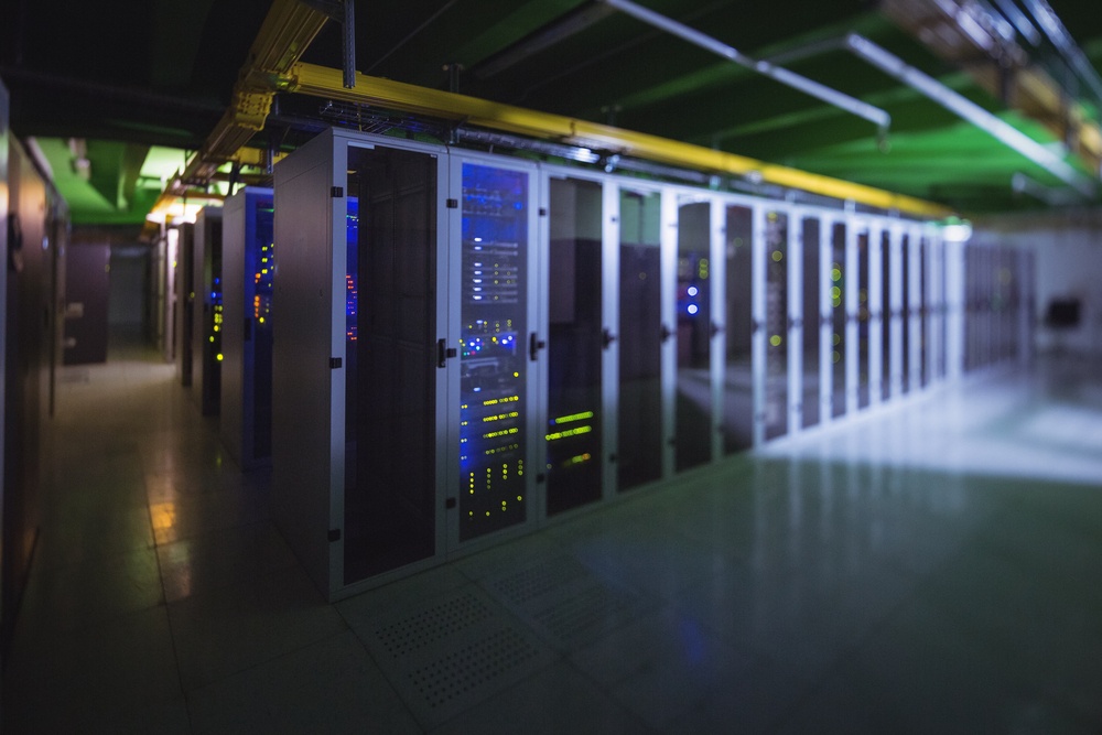 Hallway with a row of servers in server room-1